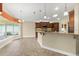 Bright eat-in kitchen with granite countertops, wood cabinets, and a view of the backyard at 1481 Areca Palm Dr, Port Orange, FL 32128