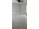 Neutral bedroom with modern marble-look tile flooring and ceiling fan at 1568 Pendleton St, Deltona, FL 32725