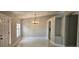 Bright dining room featuring marble floors, neutral paint, and a decorative ceiling light fixture at 1568 Pendleton St, Deltona, FL 32725