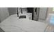 Kitchen island with quartz countertops and stainless steel sink, set in a bright, open-concept space at 1568 Pendleton St, Deltona, FL 32725