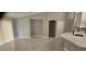 Open-concept kitchen with white cabinets, stainless steel appliances, and a bright, airy feel overlooking a dining space at 1568 Pendleton St, Deltona, FL 32725