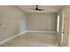 Bright living room featuring marble floors, neutral paint, a ceiling fan and a front door entrance at 1568 Pendleton St, Deltona, FL 32725