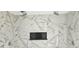 Close up of the luxurious marble look tile in the shower at 1568 Pendleton St, Deltona, FL 32725