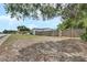 Expansive backyard featuring a privacy fence and lush lawn, offering ample room for outdoor activities and relaxation at 1590 Urbana Ave, Deltona, FL 32725