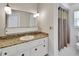 Neutral bathroom features a vanity with granite counter, a sink, and a shower/tub combo at 1590 Urbana Ave, Deltona, FL 32725