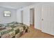 Bedroom with laminate floors, closet doors and natural light from the window at 1590 Urbana Ave, Deltona, FL 32725
