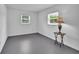 Bedroom featuring two windows and a lamp at 1590 Urbana Ave, Deltona, FL 32725