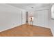 An empty bedroom with hardwood floors, a closet and a window with lots of light at 1590 Urbana Ave, Deltona, FL 32725