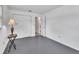 An empty bedroom showcases closet, neutral paint, and view into en-suite bathroom at 1590 Urbana Ave, Deltona, FL 32725