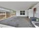 Covered patio featuring an adjacent privacy fence, offering a secluded outdoor space to relax, entertain, or enjoy fresh air at 1590 Urbana Ave, Deltona, FL 32725