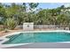 Beautiful in-ground pool surrounded by lush greenery and shed, ideal for relaxing outdoors at 1590 Urbana Ave, Deltona, FL 32725