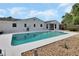 Backyard pool featuring clean, clear blue water and ample space for relaxation in a spacious fenced-in backyard at 1590 Urbana Ave, Deltona, FL 32725