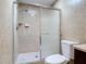 Bathroom with tile shower, glass door, and tile walls at 16 Big Buck Trl, Ormond Beach, FL 32174