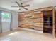 Charming bedroom with a unique wooden accent wall and ample closet space at 16 Big Buck Trl, Ormond Beach, FL 32174