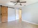 Bedroom with tile floors, and a door leading to another room at 16 Big Buck Trl, Ormond Beach, FL 32174