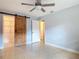 Bright bedroom with a sliding barn door closet and views of the ensuite at 16 Big Buck Trl, Ormond Beach, FL 32174