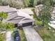 Charming townhome featuring a spacious driveway and attached garage with manicured lawn at 16 Big Buck Trl, Ormond Beach, FL 32174