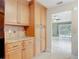Kitchen featuring wood cabinetry, granite counters, and stainless steel appliances at 16 Big Buck Trl, Ormond Beach, FL 32174