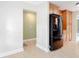 Open kitchen layout with stainless steel refrigerator and tile flooring at 16 Big Buck Trl, Ormond Beach, FL 32174