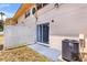 View of backyard with patio, AC unit, and view of house at 1600 S Palmetto Ave # 105, South Daytona, FL 32119