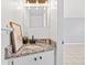 Stylish bathroom with a granite countertop, modern fixtures, and decorative lighting at 1600 S Palmetto Ave # 105, South Daytona, FL 32119