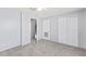Bedroom with neutral tones, plush carpeting, and a closet at 1600 S Palmetto Ave # 105, South Daytona, FL 32119