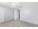 Spacious bedroom features neutral tones, plush carpeting, ceiling fan, and two closets at 1600 S Palmetto Ave # 105, South Daytona, FL 32119