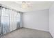 Bedroom features plush carpeting, ceiling fan, and window at 1600 S Palmetto Ave # 105, South Daytona, FL 32119