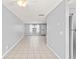 Bright, tiled living room with ceiling fan and a front door entrance for a welcoming atmosphere at 1600 S Palmetto Ave # 105, South Daytona, FL 32119