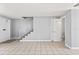 Bright and airy living room featuring tile floors and staircase with white railings at 1600 S Palmetto Ave # 105, South Daytona, FL 32119