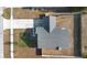 Aerial view of a single-Gathering house showcasing the roof, driveway, fenced yard and neighborhood at 1626 Lansfield Ave, Deltona, FL 32738