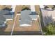 Drone shot displaying the roof and fenced in backyard of a single-Gathering home in a residential neighborhood at 1626 Lansfield Ave, Deltona, FL 32738