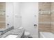 Bathroom featuring granite countertops, modern tile, and a shower-tub combination at 1626 Lansfield Ave, Deltona, FL 32738