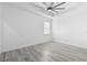 Spacious bedroom with tray ceiling, modern ceiling fan and a bright window at 1626 Lansfield Ave, Deltona, FL 32738