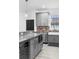 Kitchen featuring stainless appliances, wine cooler, granite countertop and farmhouse sink at 1626 Lansfield Ave, Deltona, FL 32738