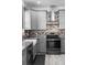 Kitchen with stainless steel appliances, granite countertops, farmhouse sink and decorative backsplash at 1626 Lansfield Ave, Deltona, FL 32738