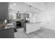 Modern kitchen with stainless steel appliances, granite countertops, and a stylish backsplash at 1626 Lansfield Ave, Deltona, FL 32738