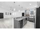 Open floor plan, a view of the kitchen, dining and living spaces at 1626 Lansfield Ave, Deltona, FL 32738
