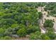 Aerial view of the property, showcasing lush greenery and neighborhood surroundings at 1690 S Adelle Ave, Deland, FL 32720