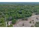 Aerial view of the wooded property showcasing natural landscape and surroundings at 1690 S Adelle Ave, Deland, FL 32720
