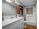Clean bathroom with a spacious vanity, bathtub, and tiled walls and floors at 1690 S Adelle Ave, Deland, FL 32720