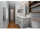 Well-lit bathroom with a modern vanity, lots of storage and easy access to hallway at 1690 S Adelle Ave, Deland, FL 32720