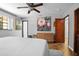 Light-filled bedroom with tiled floors, and neutral paint, perfect for personalization at 1690 S Adelle Ave, Deland, FL 32720