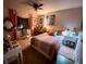 A cozy bedroom with personalized decor, bright light and comfortable furnishings at 1690 S Adelle Ave, Deland, FL 32720