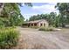 Charming single-story home with lush landscaping and a private driveway at 1690 S Adelle Ave, Deland, FL 32720