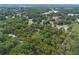 Land parcel surrounded by lush greenery and trees, perfect for a serene and private homesite at 1690 S Adelle Ave, Deland, FL 32720