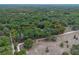 Expansive lot with mature trees and lush vegetation, offering privacy and natural beauty at 1690 S Adelle Ave, Deland, FL 32720