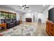 Spacious living room with large window, tile flooring, and comfortable seating at 1690 S Adelle Ave, Deland, FL 32720