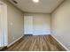 Clean bedroom with wood-look flooring, ample space, and a neutral color scheme at 175 Center St, Daytona Beach, FL 32117