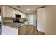 Bright kitchen boasts stainless steel appliances, granite countertops, and sleek white cabinets at 175 Center St, Daytona Beach, FL 32117